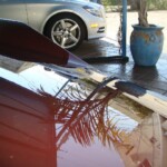 Before and after photographs of a damaged Porsche that was repaired by Elite Paint & Body Shop in West Palm Beach, Florida.